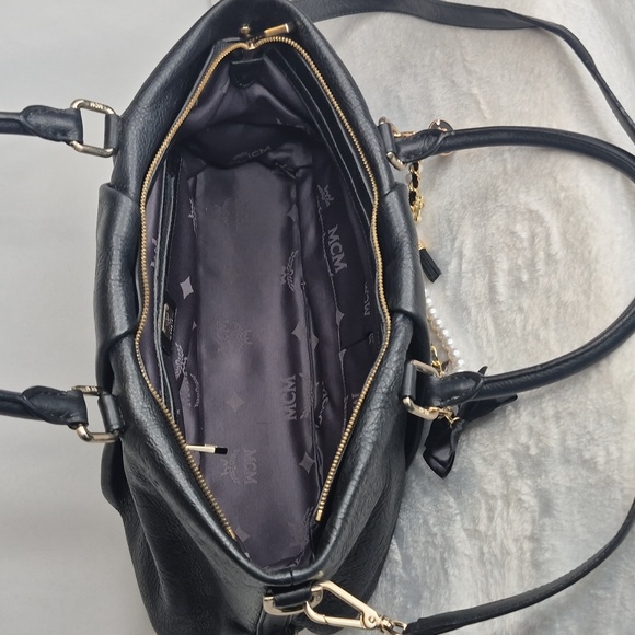 MCM Black Leather Handbag with Gold Accents - Picture 15 of 17